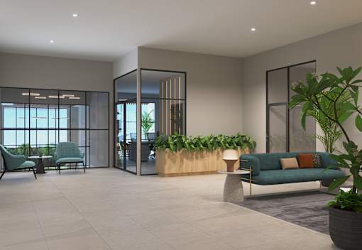 A modern living room with a green sofa and plants.