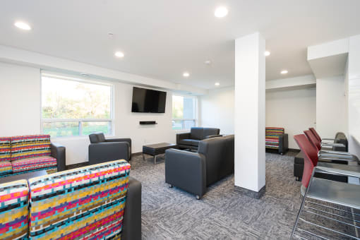 resident lounge with furniture and a flat screen tv