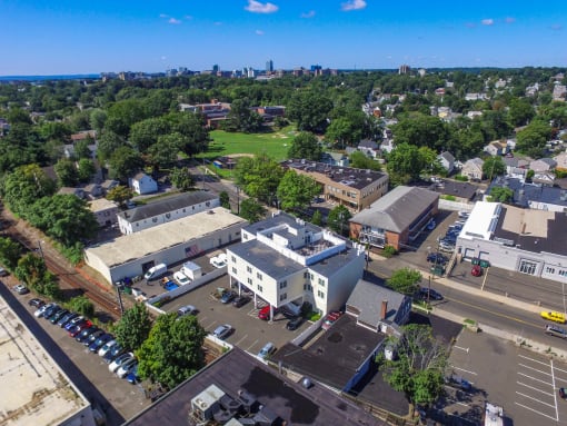 an aerial view of the campus with the city in the background