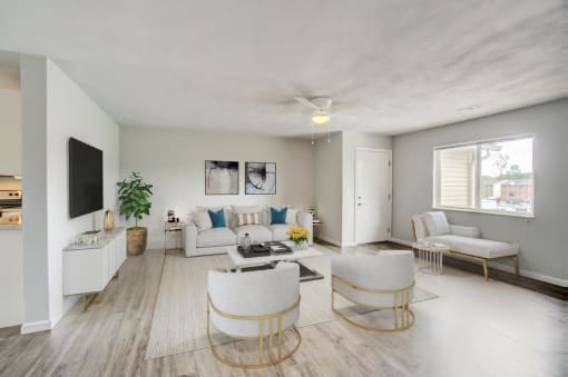 a living room filled with furniture and a flat screen tv