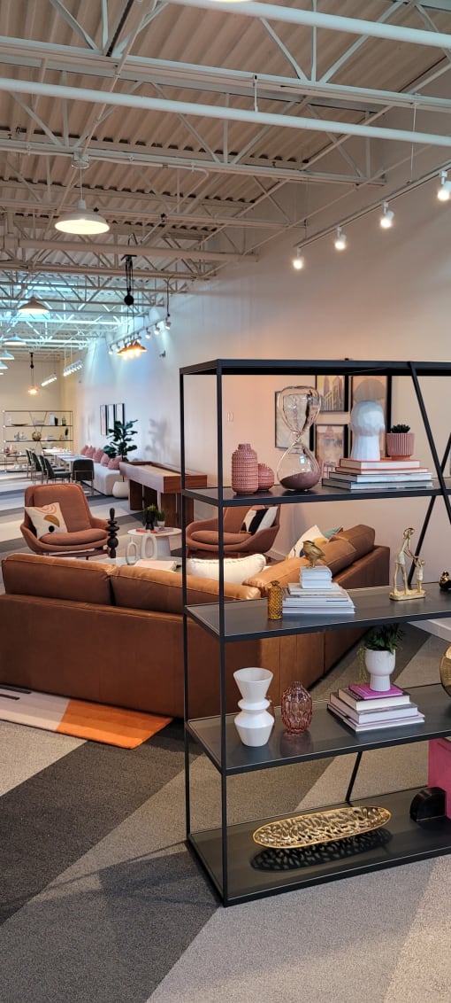 a room filled with furniture and a large window