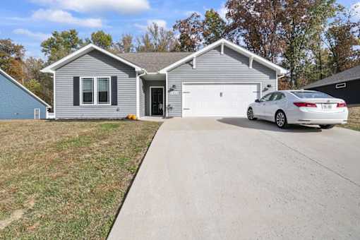 a house with a car parked in a driveway