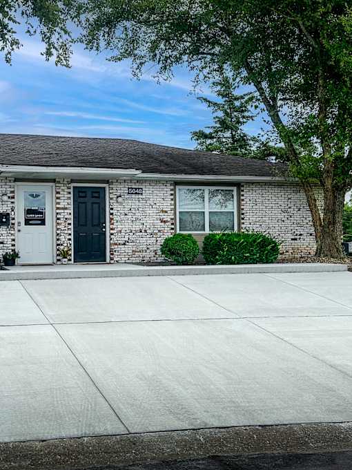 A house with a black door and a white door.