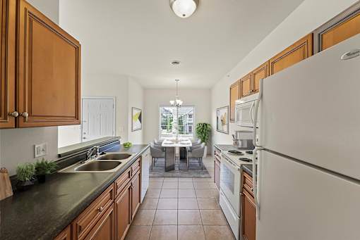 a kitchen with wooden cabinets and a white refrigerator