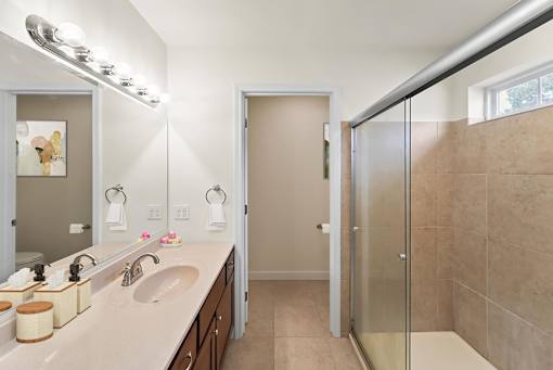a bathroom with a sink and a shower
