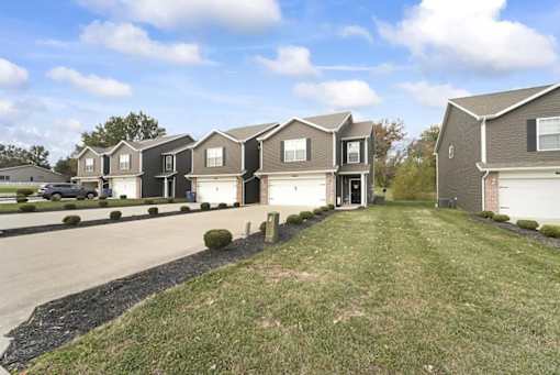 a row of houses on the side of a road