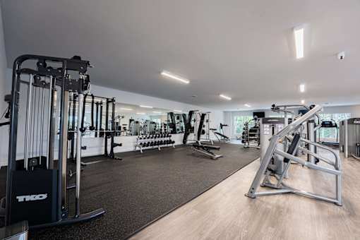 A gym with a variety of equipment including a TKO machine.
