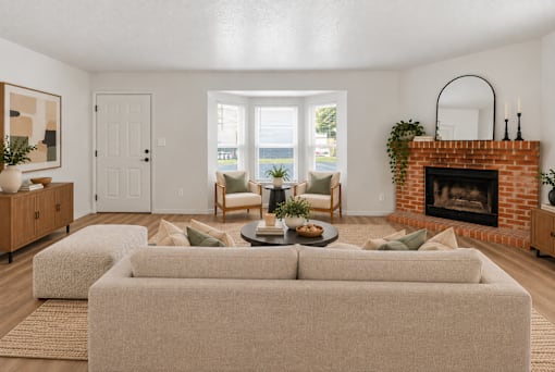 A living room with a fireplace and a couch.