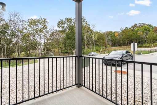 A black metal fence with a pole in the middle.