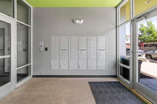 A wall of white switches and sockets in a room.
