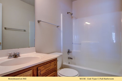 A white bathroom with a toilet and sink.