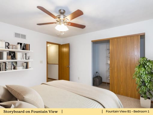 a bedroom with a bed and a ceiling fan