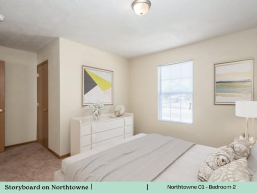 a bedroom with a white bed and a white dresser