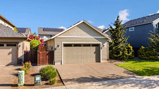 A house with a garage and a driveway.