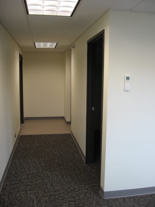 a view of the ceiling in a hallway of a building