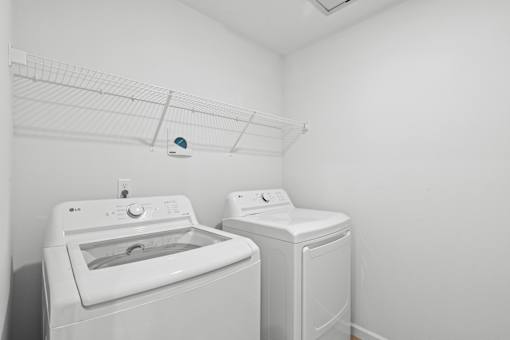 A white dryer and washer in a laundry room.