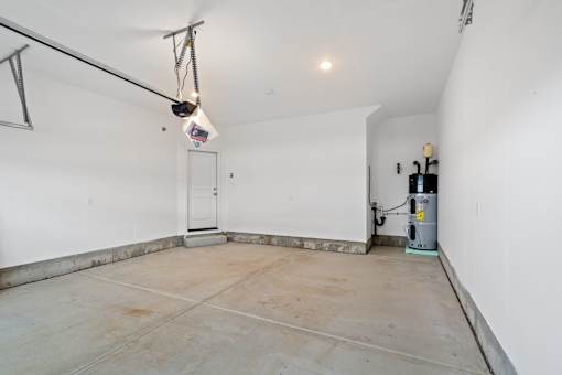 A room with a white door and a white wall.