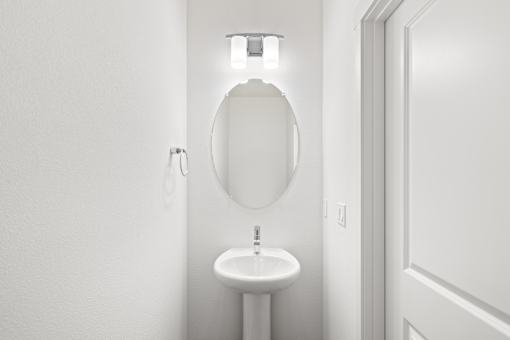 A white bathroom with a toilet and sink.