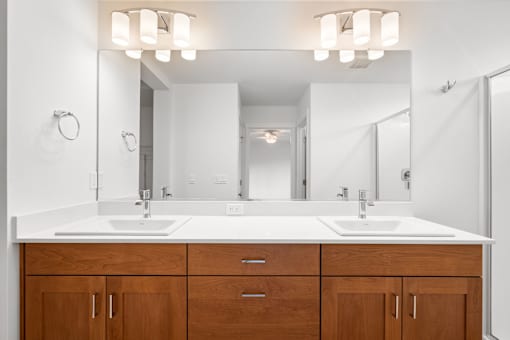 Bathroom with a white countertop and a mirror above it.
