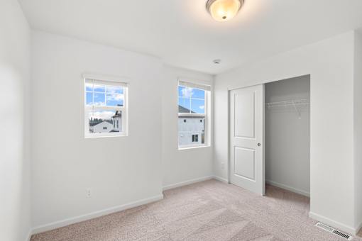 A room with a window and a door.