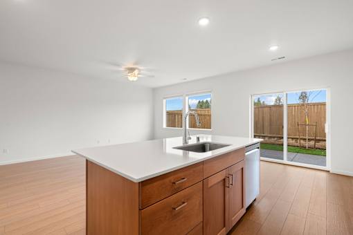Kitchen with wooden cabinets and a white countertop.
