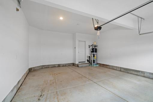 A room with a white door and a white wall.