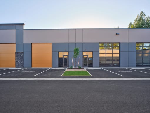 the exterior of a building with a parking lot