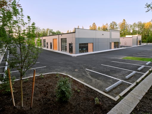 an empty parking lot in front of a building