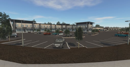 a parking lot with cars in front of a building