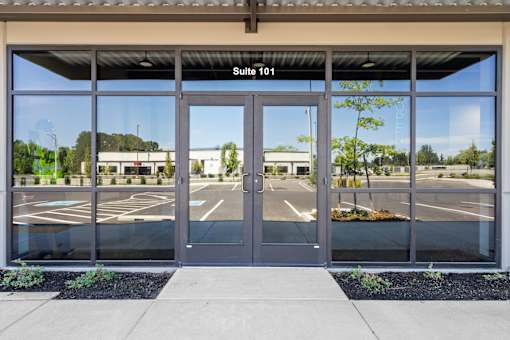 Suite 101 is the address on the sign above the door.