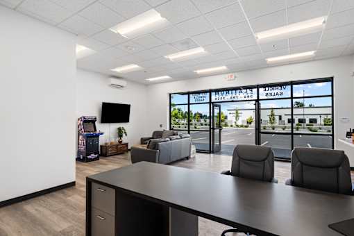 A conference room with a view of the parking lot outside.