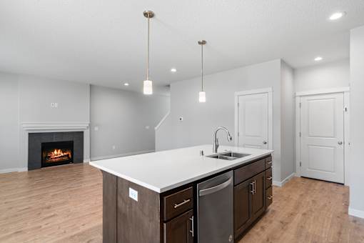 Island with Quartz Countertops, Sink Disposal and Breakfast Bar