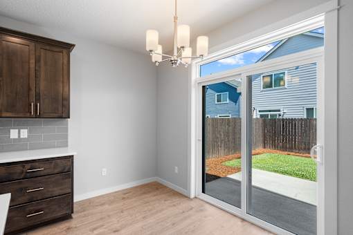 Dining Area with Sliding Glass Door Access to Patio