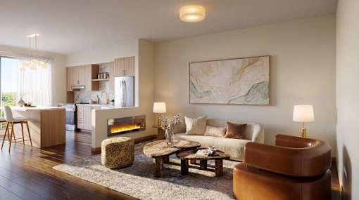 A living room with a fireplace and a painting on the wall.