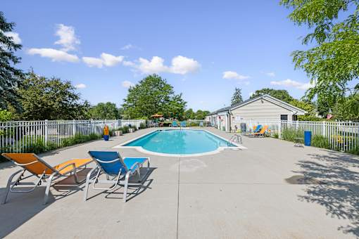 Pool with seating and landscaping at Bainbridge Park Canton MI