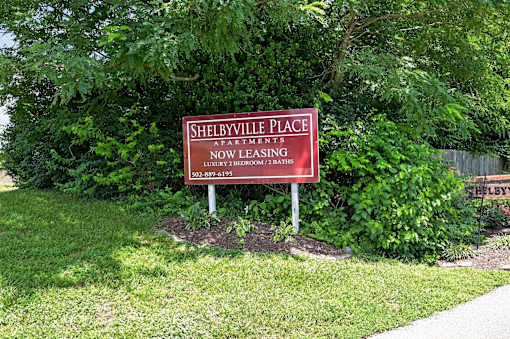 A sign for Shelbyville Place Apartments is now leasing.