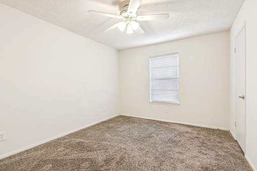 Room with ceiling fan and carpet at Ashford Place Mobile AL
