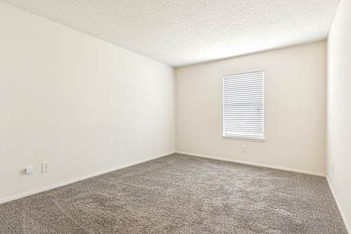 Room with carpet and window at Ashford Place Mobile AL