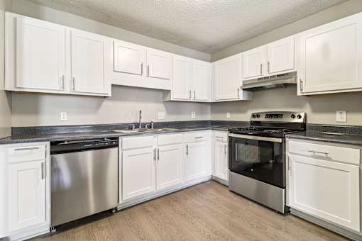 Kitchen with white cabinetry at Avalon Place Columbia SC