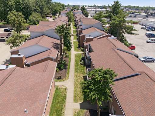 A long row of houses with red roofs.