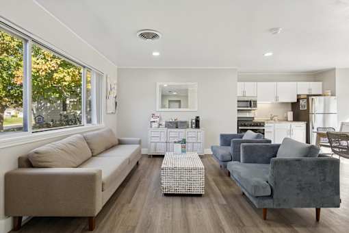 A living room with a grey couch and a coffee table.