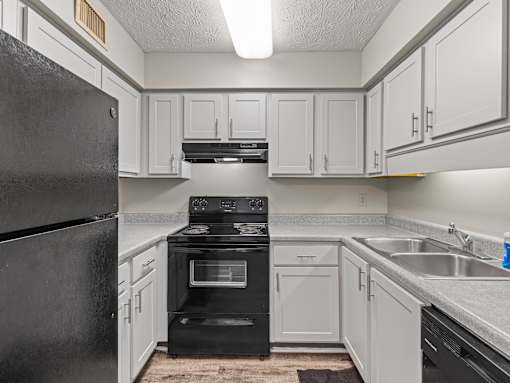 Kitchen with white cabinets at Stratford Village Montgomery AL