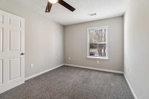 Room with ceiling fan and window blinds at Avalon Place Columbia SC
