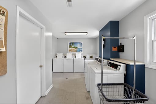 A laundry room with a washer and dryer in it.