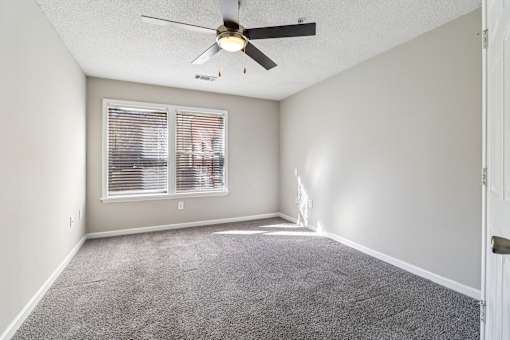 Room with carpet and ceiling fan at Avalon Place Columbia SC