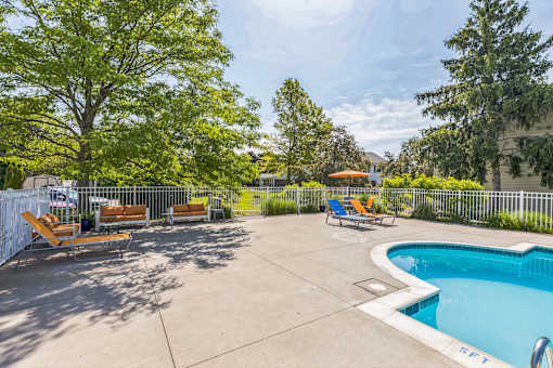 Pool area with loungers at Bainbridge Park Canton MI