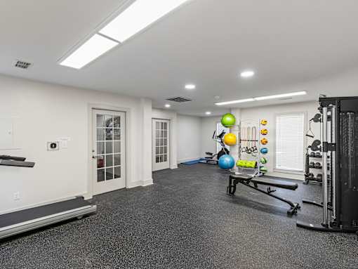 Fitness center with weights and equipment at Park at Meadow Ridge Montgomery AL