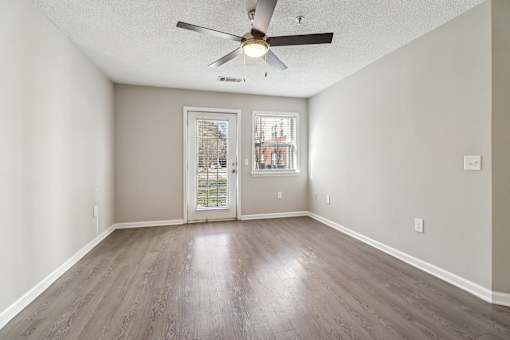 Room with ceiling fan and balcony door at Avalon Place Columbia SC