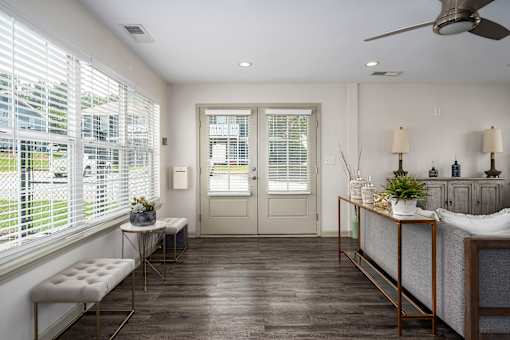 Community room with seating at Arbours at Victoria Place Prattville AL