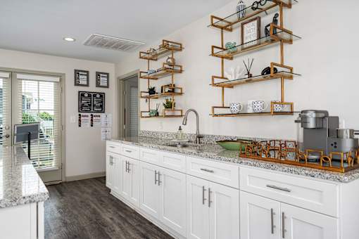 Modern kitchen with marble counters at Arbours at Victoria Place Prattville AL